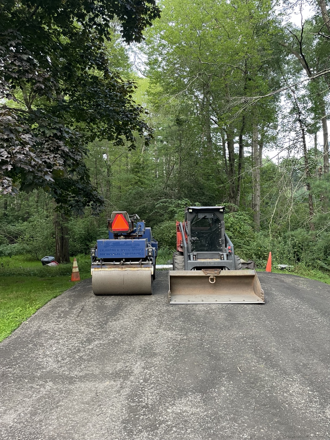 M.T.C. roller and skid steer on a paving project